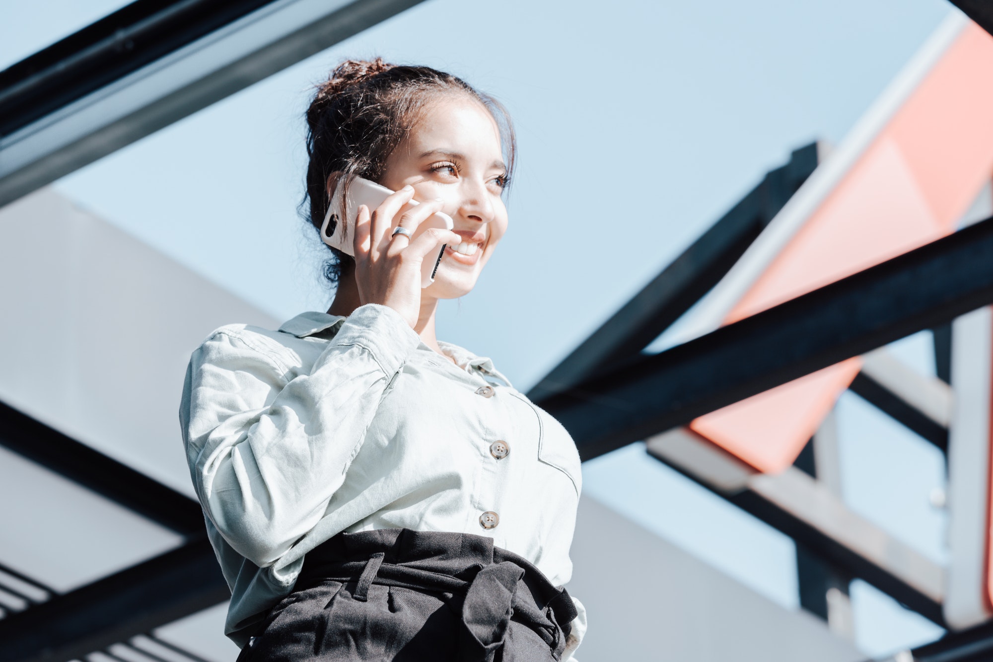 Young arab woman entrepreneur woman smiling,doing phone calls